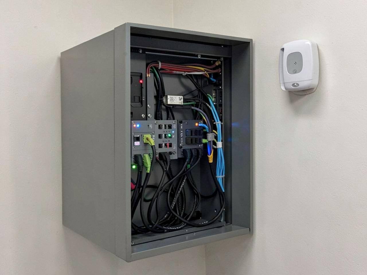 Structured data cabling being terminated in a commercial comms cabinet in Berkshire