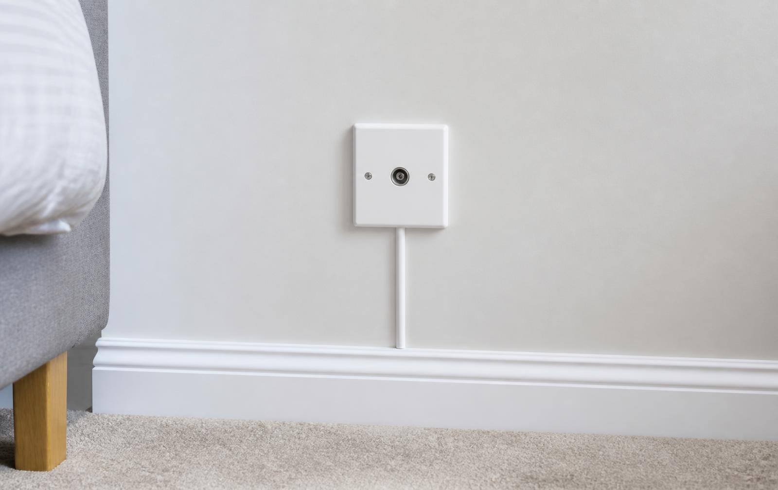 New aerial socket being fitted to a living room wall in Berkshire